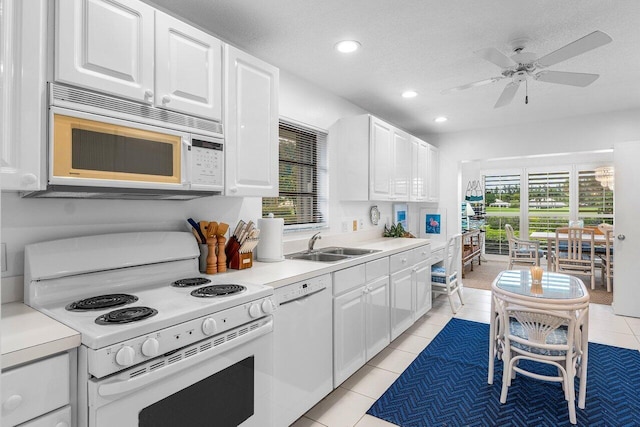 4511 Meadowlark Ln, Boynton Beach, FL 33436 - kitchen with a ceiling fan, white cabinets, white appliances, light countertops, and recessed lighting
