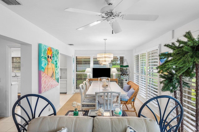4511 Meadowlark Ln, Boynton Beach, FL 33436 - dining room featuring light tile patterned floors, visible vents, and ceiling fan with notable chandelier