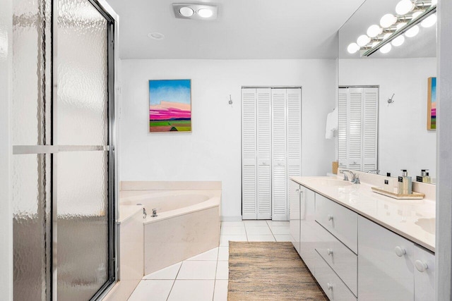4511 Meadowlark Ln, Boynton Beach, FL 33436 - full bath featuring a closet, a bath, a sink, tile patterned flooring, and double vanity