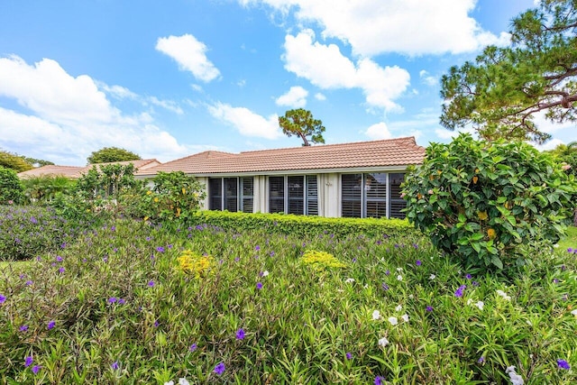 4511 Meadowlark Ln, Boynton Beach, FL 33436 - view of side of property featuring a tile roof