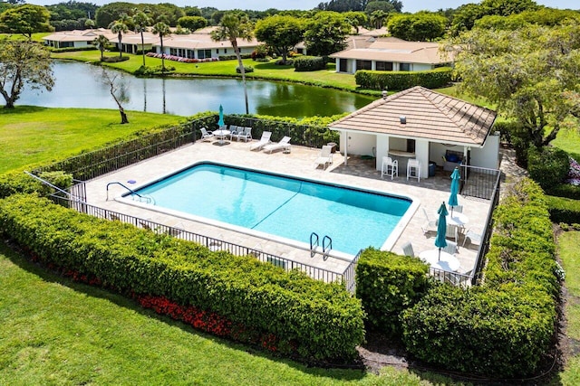 4511 Meadowlark Ln, Boynton Beach, FL 33436 - pool featuring a yard, a water view, fence, and a patio area