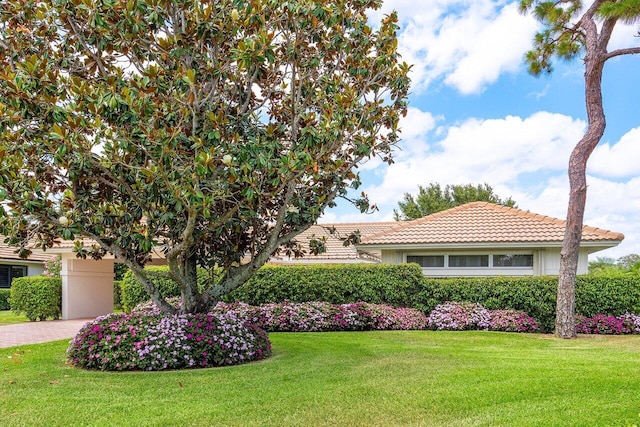 4511 Meadowlark Ln, Boynton Beach, FL 33436 - view of front of property featuring a front lawn, a tiled roof, and driveway