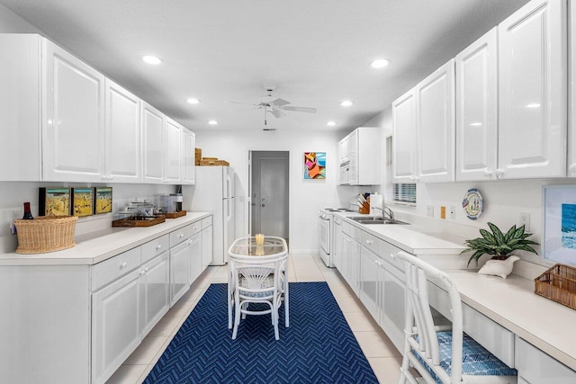 4511 Meadowlark Ln, Boynton Beach, FL 33436 - kitchen featuring a ceiling fan, white appliances, white cabinets, and recessed lighting