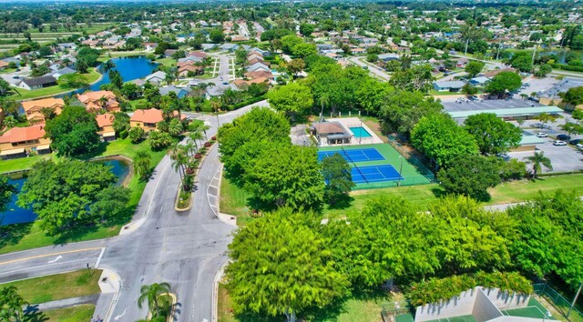 drone / aerial view with a residential view and a water view