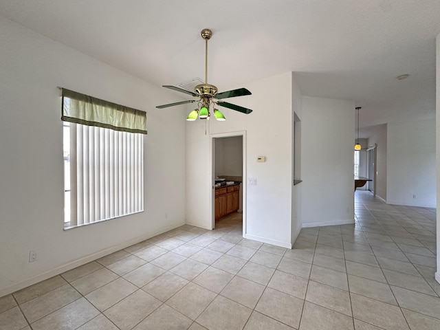 573 SW Saint Kitts St, Port Saint Lucie, FL 34953 - unfurnished room with plenty of natural light, ceiling fan, and light tile patterned floors