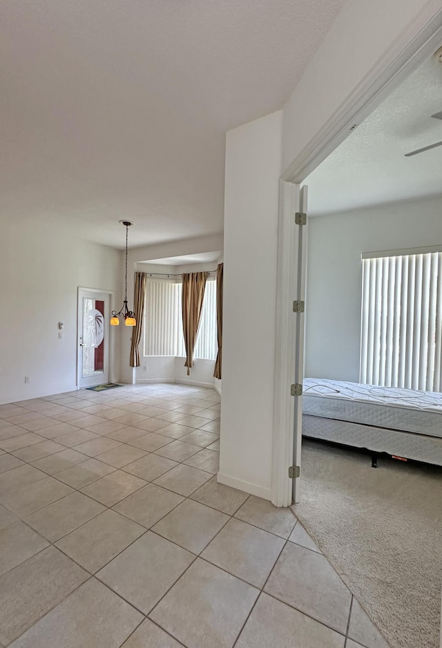 573 SW Saint Kitts St, Port Saint Lucie, FL 34953 - empty room featuring light tile patterned flooring