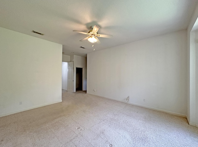 573 SW Saint Kitts St, Port Saint Lucie, FL 34953 - unfurnished room featuring ceiling fan, light colored carpet, and a textured ceiling