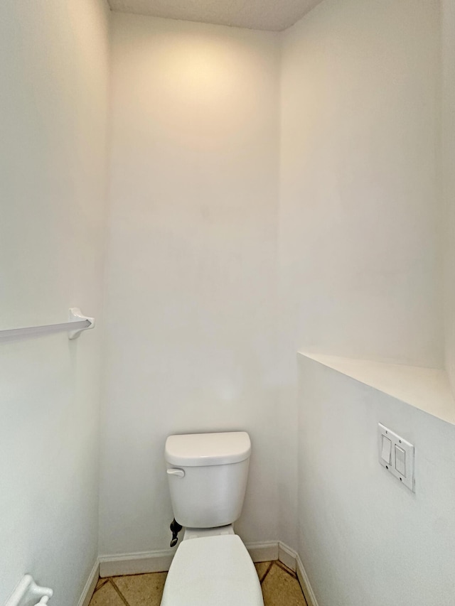 573 SW Saint Kitts St, Port Saint Lucie, FL 34953 - bathroom featuring toilet and baseboards