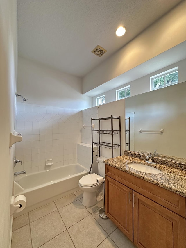 573 SW Saint Kitts St, Port Saint Lucie, FL 34953 - full bathroom featuring vanity, tile patterned floors, tub / shower combination, recessed lighting, and a textured ceiling
