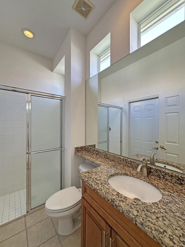 573 SW Saint Kitts St, Port Saint Lucie, FL 34953 - bathroom featuring a shower stall, vanity, and tile patterned floors