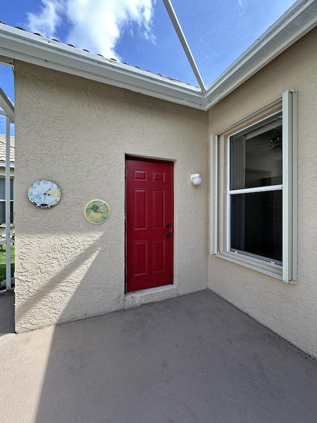 573 SW Saint Kitts St, Port Saint Lucie, FL 34953 - view of exterior entry with stucco siding