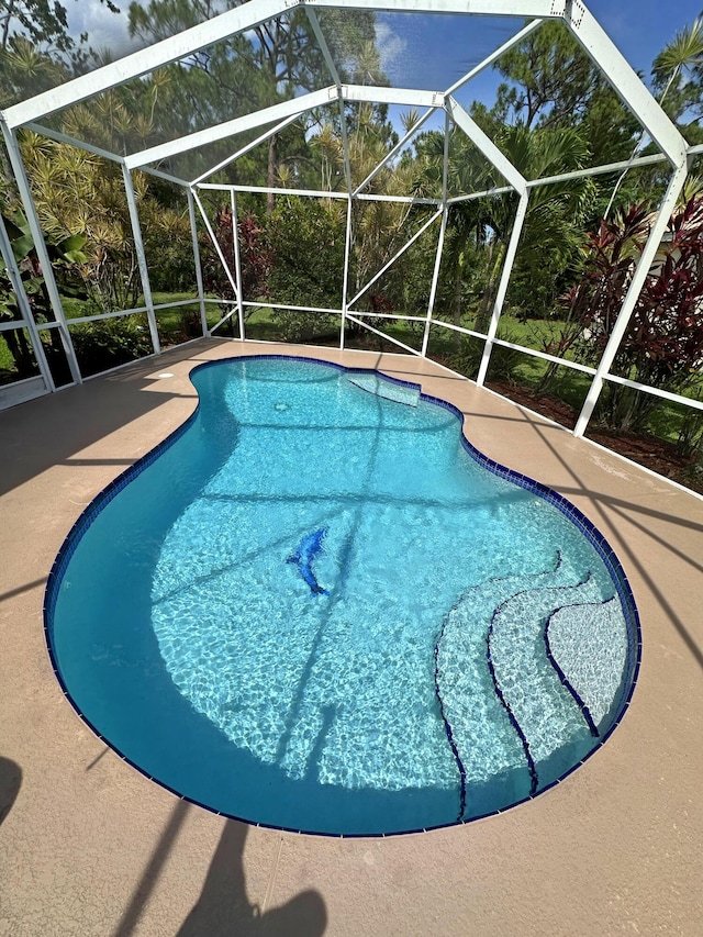 573 SW Saint Kitts St, Port Saint Lucie, FL 34953 - swimming pool with a patio and a lanai