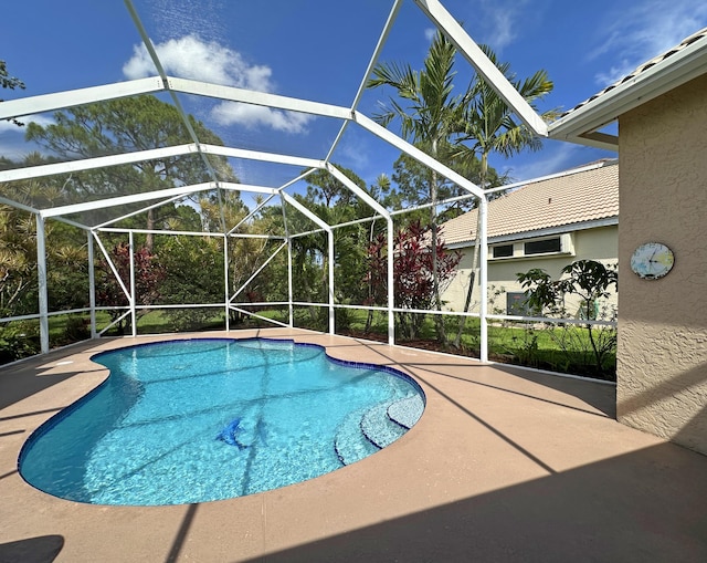 573 SW Saint Kitts St, Port Saint Lucie, FL 34953 - swimming pool with a patio area and a lanai