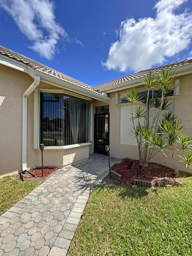 573 SW Saint Kitts St, Port Saint Lucie, FL 34953 - entrance to property featuring stucco siding