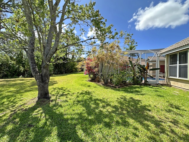 573 SW Saint Kitts St, Port Saint Lucie, FL 34953 - view of grassy yard with a pool