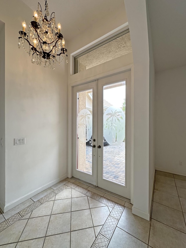 573 SW Saint Kitts St, Port Saint Lucie, FL 34953 - entrance foyer with light tile patterned flooring, french doors, and plenty of natural light
