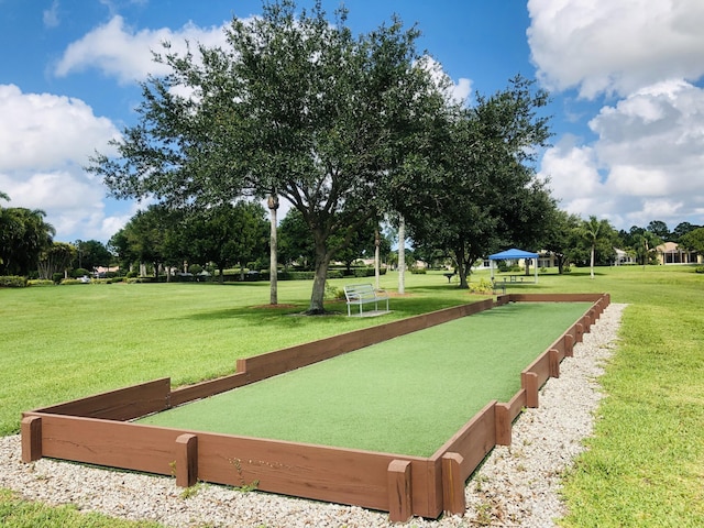 573 SW Saint Kitts St, Port Saint Lucie, FL 34953 - view of property's community featuring a bocce ball area and a yard