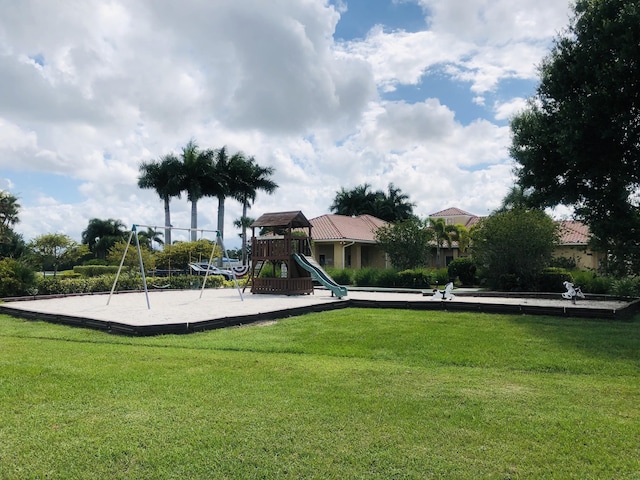 573 SW Saint Kitts St, Port Saint Lucie, FL 34953 - community play area featuring a lawn