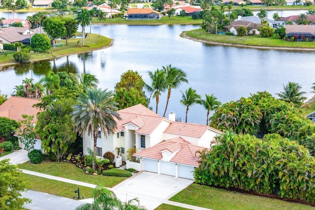 birds eye view of property with a residential view and a water view