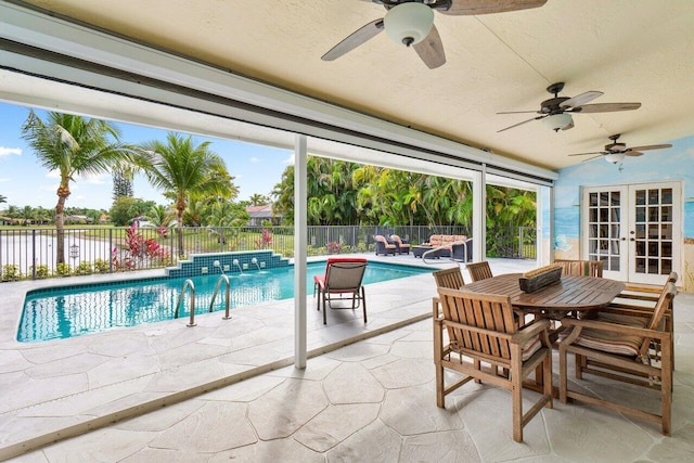 view of swimming pool with a patio, a ceiling fan, french doors, and fence