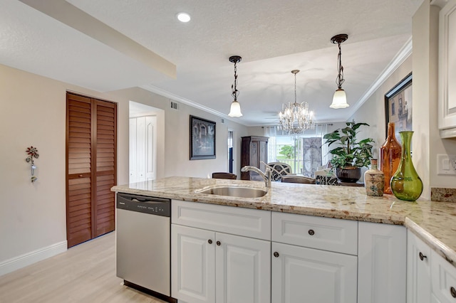 kitchen with stainless steel dishwasher, a sink, ornamental molding, a chandelier, and light wood finished floors