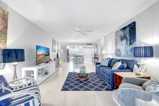 3212 S Ocean Blvd Unit 404-A, Highland Beach, FL 33487 - living area with ceiling fan and expansive windows
