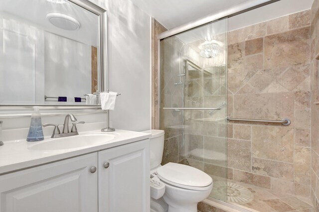 3212 S Ocean Blvd Unit 404-A, Highland Beach, FL 33487 - bedroom with multiple closets, light colored carpet, and a ceiling fan