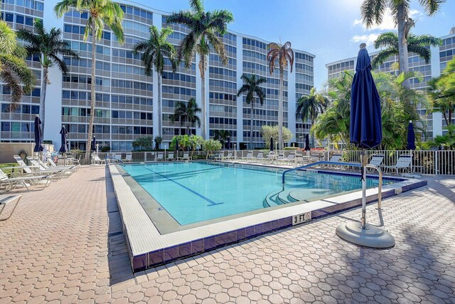 3212 S Ocean Blvd Unit 404-A, Highland Beach, FL 33487 - community pool featuring fence and a patio area