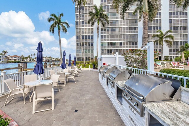 3212 S Ocean Blvd Unit 404-A, Highland Beach, FL 33487 - view of patio / terrace with area for grilling and a water view