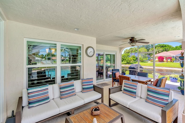 view of patio / terrace with outdoor dining area, ceiling fan, and an outdoor hangout area