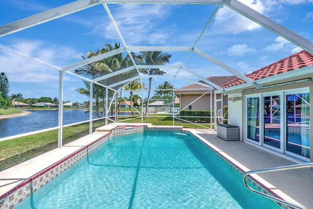 view of swimming pool featuring a lawn, a water view, glass enclosure, and a patio area