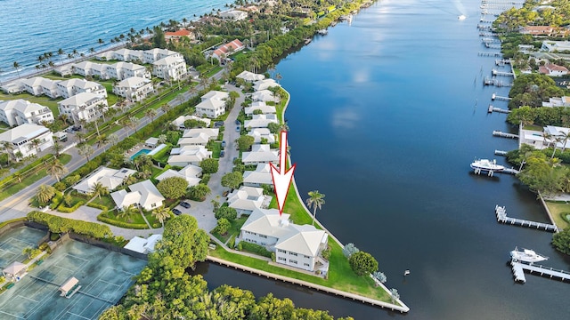 drone / aerial view featuring a water view and a residential view