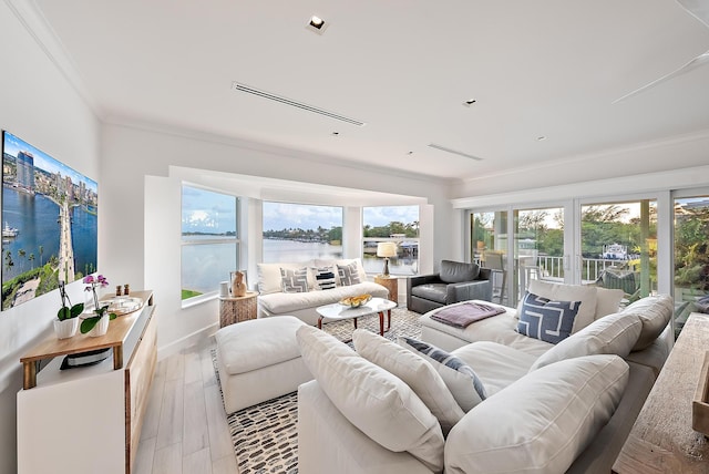 living room with french doors, crown molding, light wood finished floors, and a water view