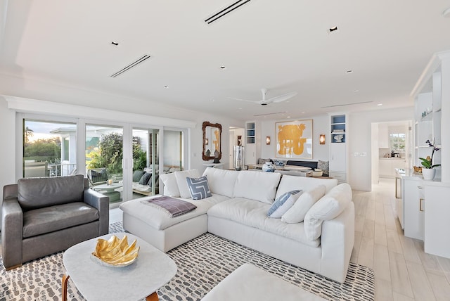 living area featuring visible vents, recessed lighting, and a ceiling fan