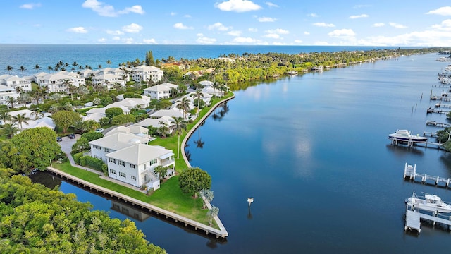 drone / aerial view featuring a residential view and a water view