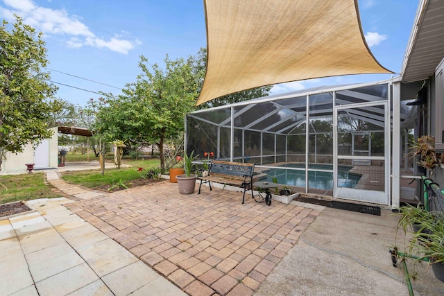 view of patio featuring glass enclosure and an outdoor pool