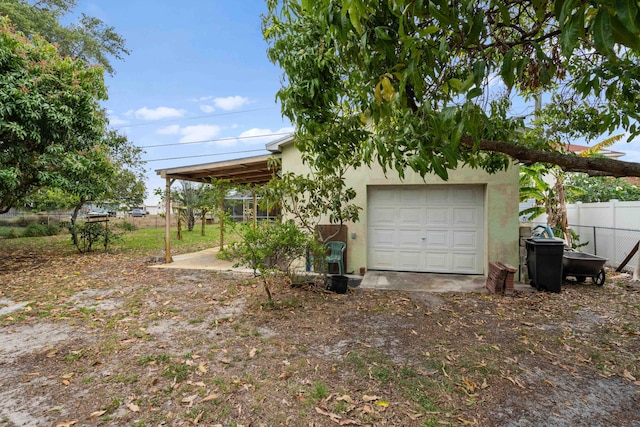 garage featuring fence