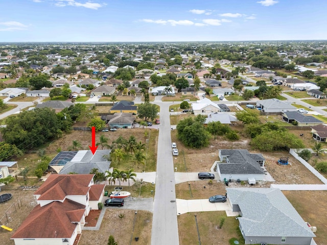 birds eye view of property with a residential view
