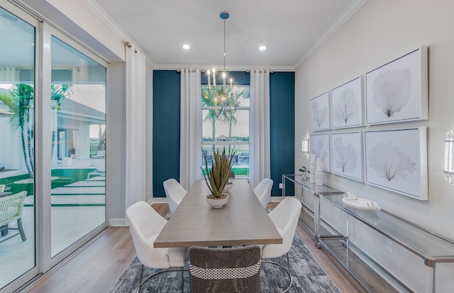 20128 Se Bridgewater Drive Oakley Model, Jupiter, FL 33458 - dining room featuring crown molding, a notable chandelier, a healthy amount of sunlight, and wood finished floors