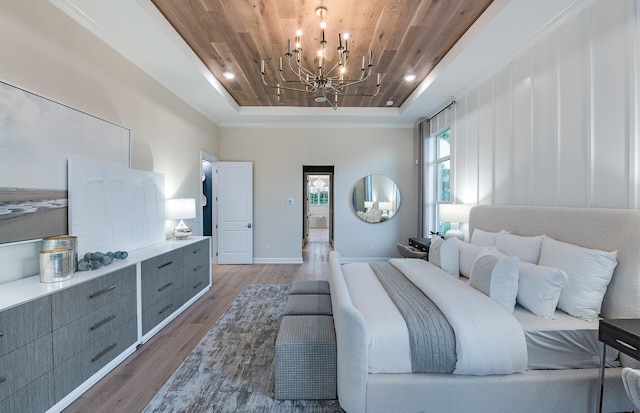 20128 Se Bridgewater Drive Oakley Model, Jupiter, FL 33458 - bedroom featuring a tray ceiling, wood finished floors, a chandelier, and wooden ceiling