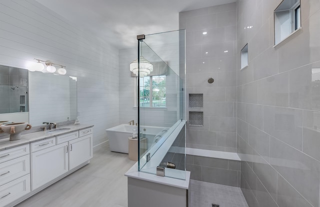 20128 Se Bridgewater Drive Oakley Model, Jupiter, FL 33458 - bathroom featuring a freestanding tub, walk in shower, and vanity