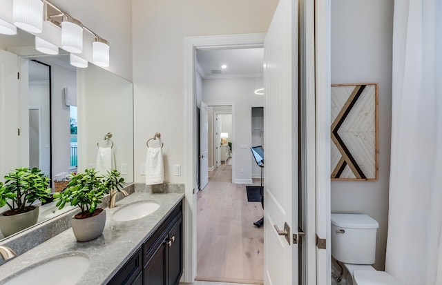 20128 Se Bridgewater Drive Oakley Model, Jupiter, FL 33458 - full bath with a sink, ornamental molding, toilet, and wood finished floors