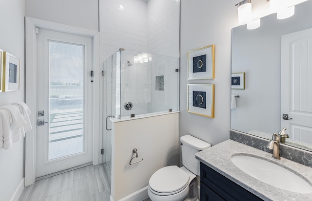 20128 Se Bridgewater Drive Oakley Model, Jupiter, FL 33458 - bathroom with toilet, baseboards, tiled shower, and vanity