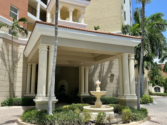 view of exterior entry featuring stucco siding