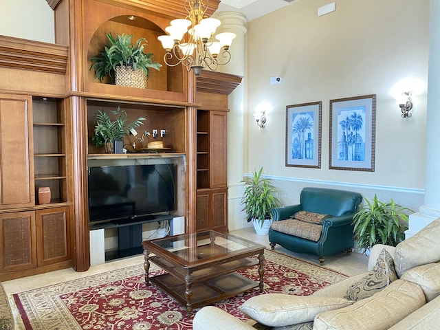 living area featuring a high ceiling, a chandelier, and built in features