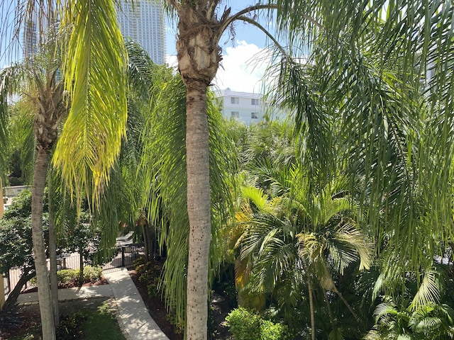 view of home's community featuring fence