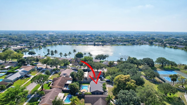 birds eye view of property featuring a water view and a residential view