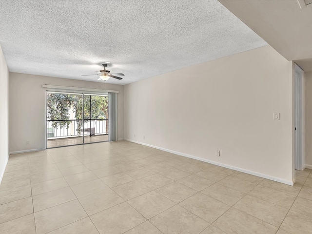 614 NW 13th St Unit 27, Boca Raton, FL 33486 - unfurnished room featuring light tile patterned floors, baseboards, ceiling fan, and a textured ceiling