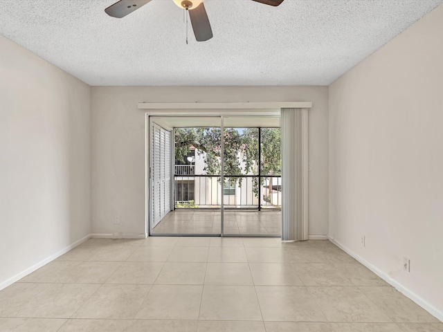 614 NW 13th St Unit 27, Boca Raton, FL 33486 - tiled empty room featuring baseboards, a ceiling fan, and a textured ceiling