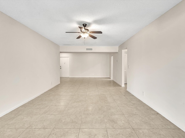 614 NW 13th St Unit 27, Boca Raton, FL 33486 - spare room featuring ceiling fan, a textured ceiling, baseboards, light tile patterned floors, and visible vents